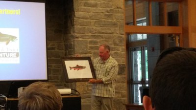 Tom Sadler holding his new brook trout print.