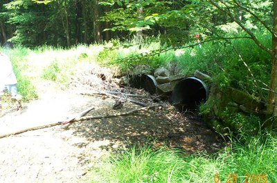 Inlet of culverts on Bobbs Creek in Pennsylvania.  Note the accumulation of debris and near complete closure of the culvert on the far left. 